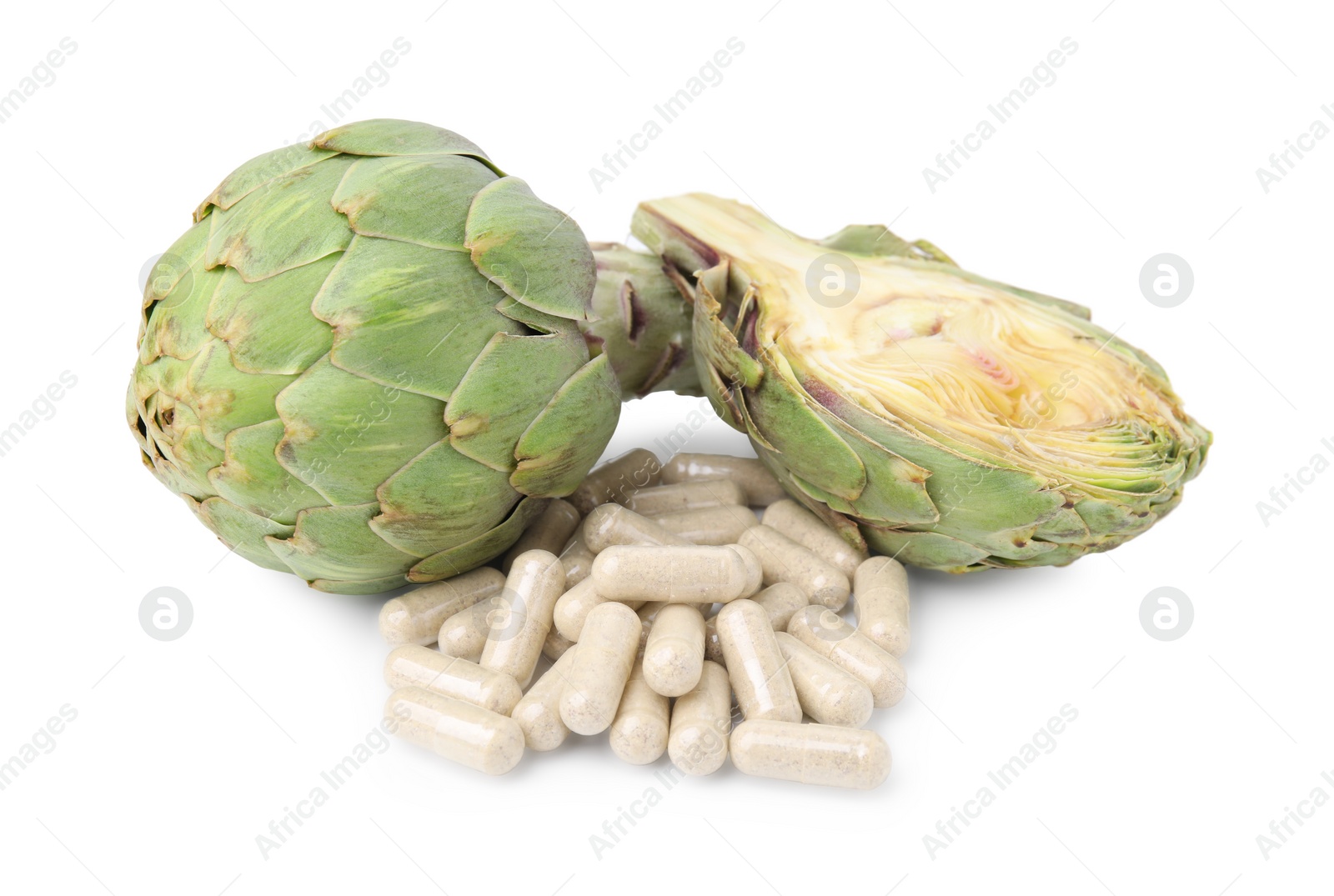 Photo of Fresh artichokes and pills isolated on white