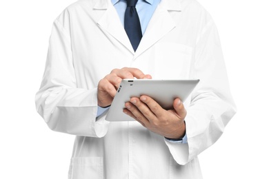 Male doctor holding modern tablet on white background, closeup