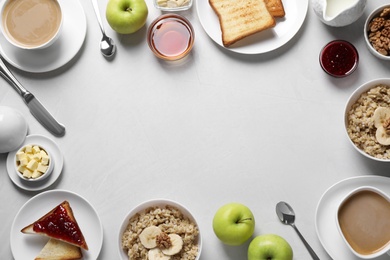 Photo of Flat lay composition with tasty breakfast food and coffee on white table. Space for text