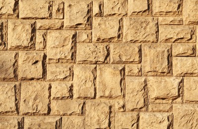 Photo of Texture of beautiful light brown stone wall as background