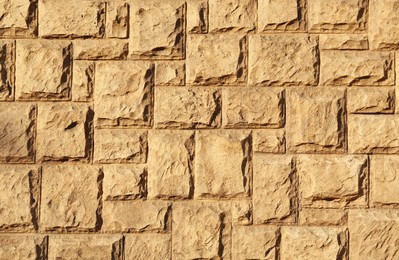 Texture of beautiful light brown stone wall as background