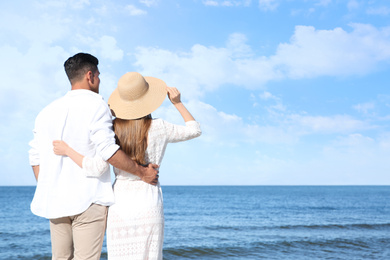 Lovely couple on beach. Space for text