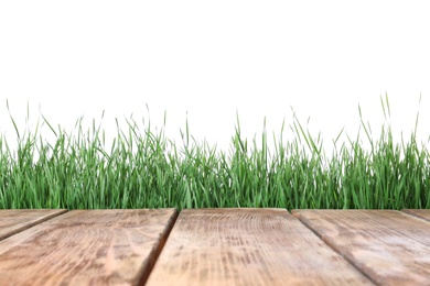 Photo of Wooden deck and green grass isolated on white