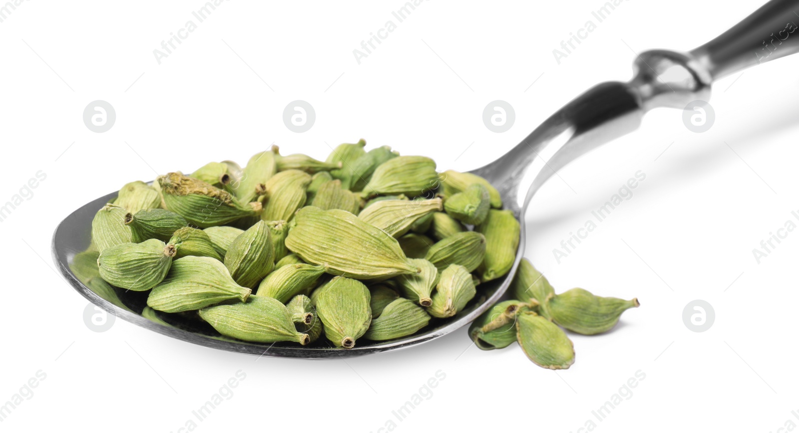 Photo of Spoon with cardamom on white background, closeup