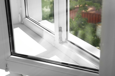 Photo of Modern window indoors, closeup view. Home interior