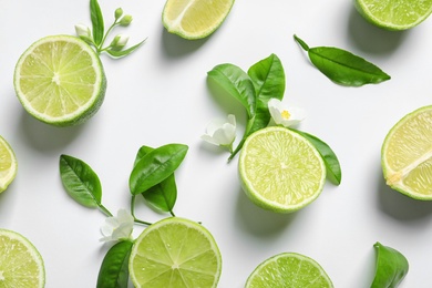 Photo of Composition with fresh ripe limes on white background, top view