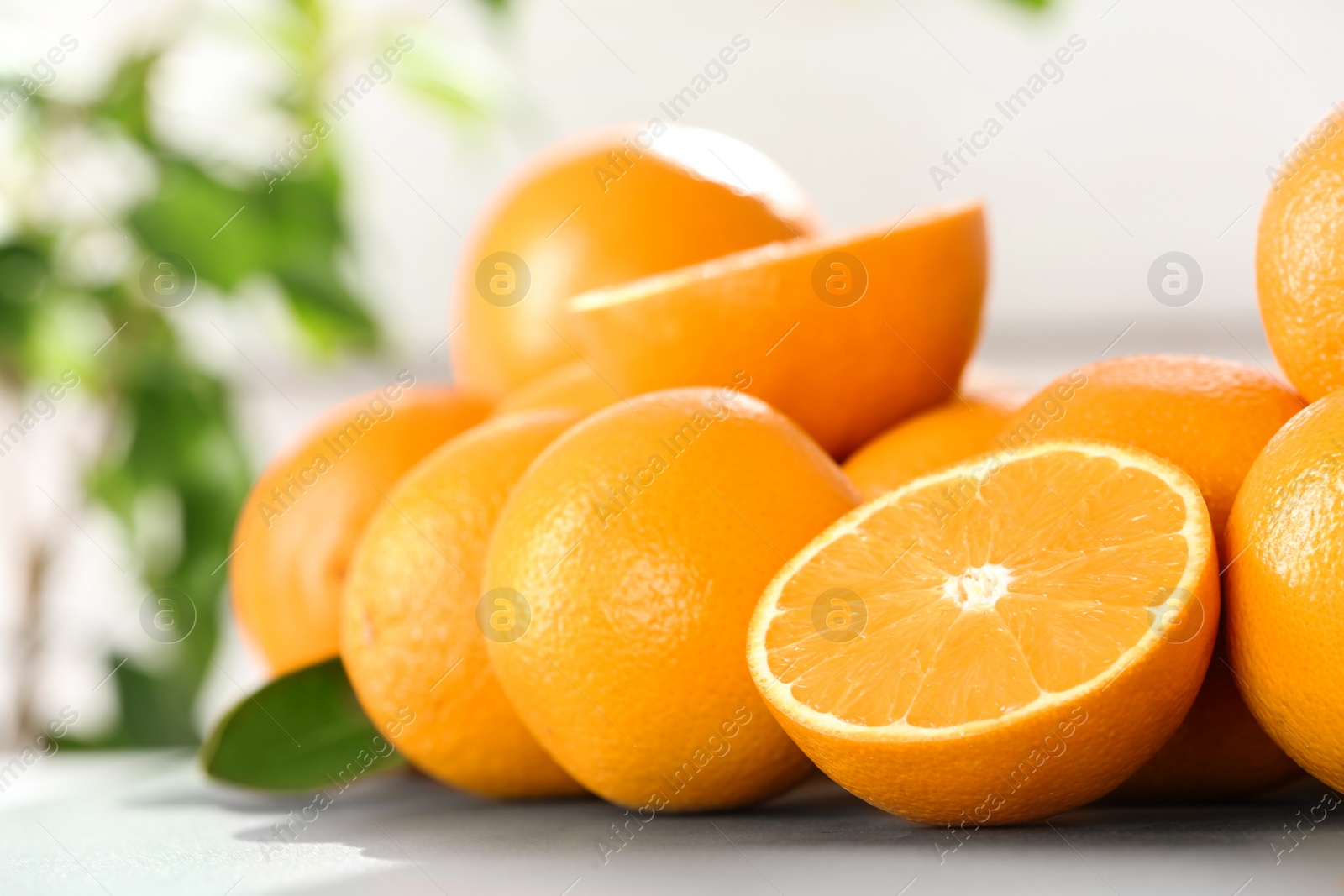 Photo of Fresh juicy oranges on table, space for text. Healthy fruits