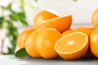 Photo of Fresh juicy oranges on table, space for text. Healthy fruits