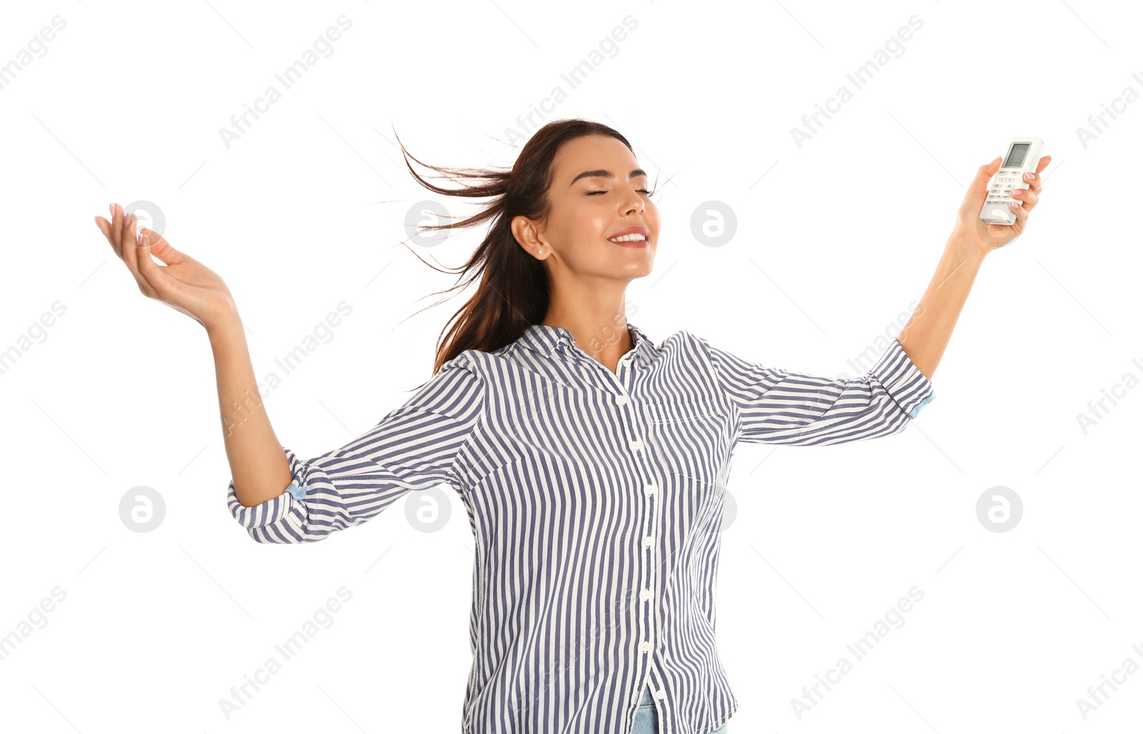 Photo of Young woman with air conditioner remote on white background