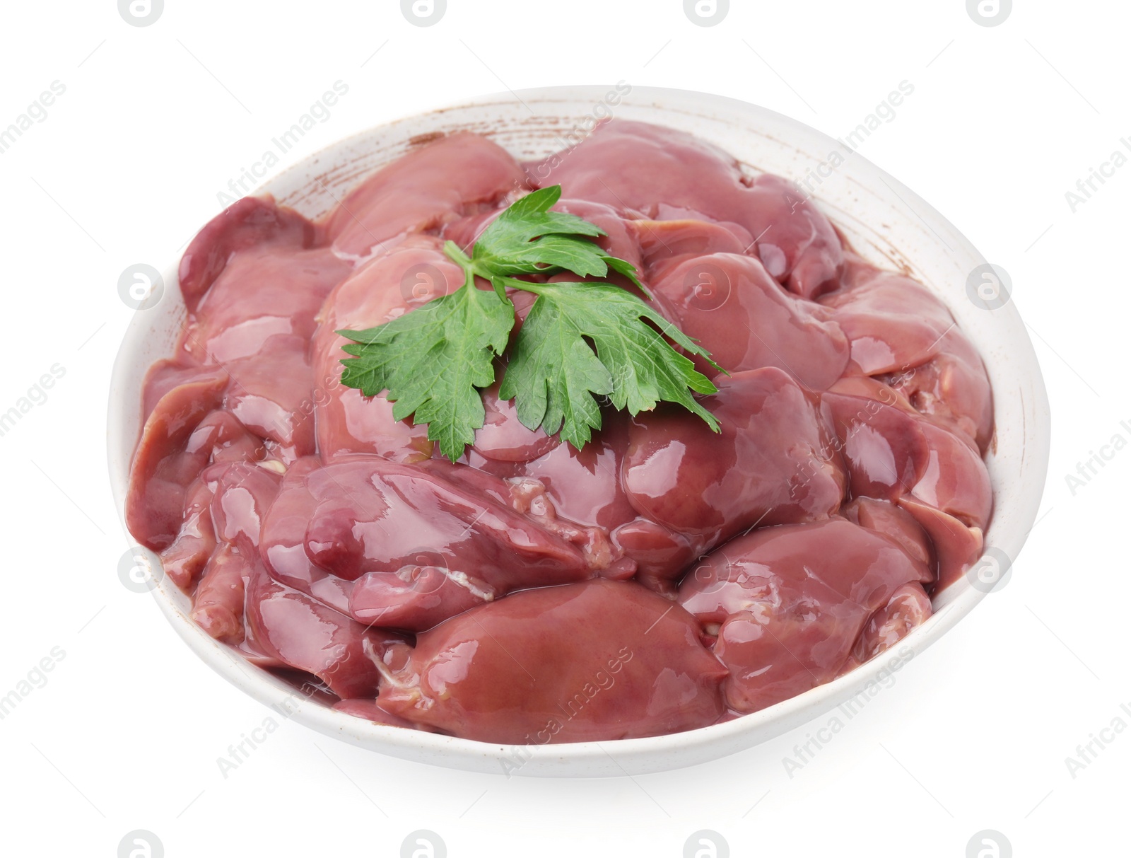 Photo of Bowl of raw chicken liver with parsley isolated on white