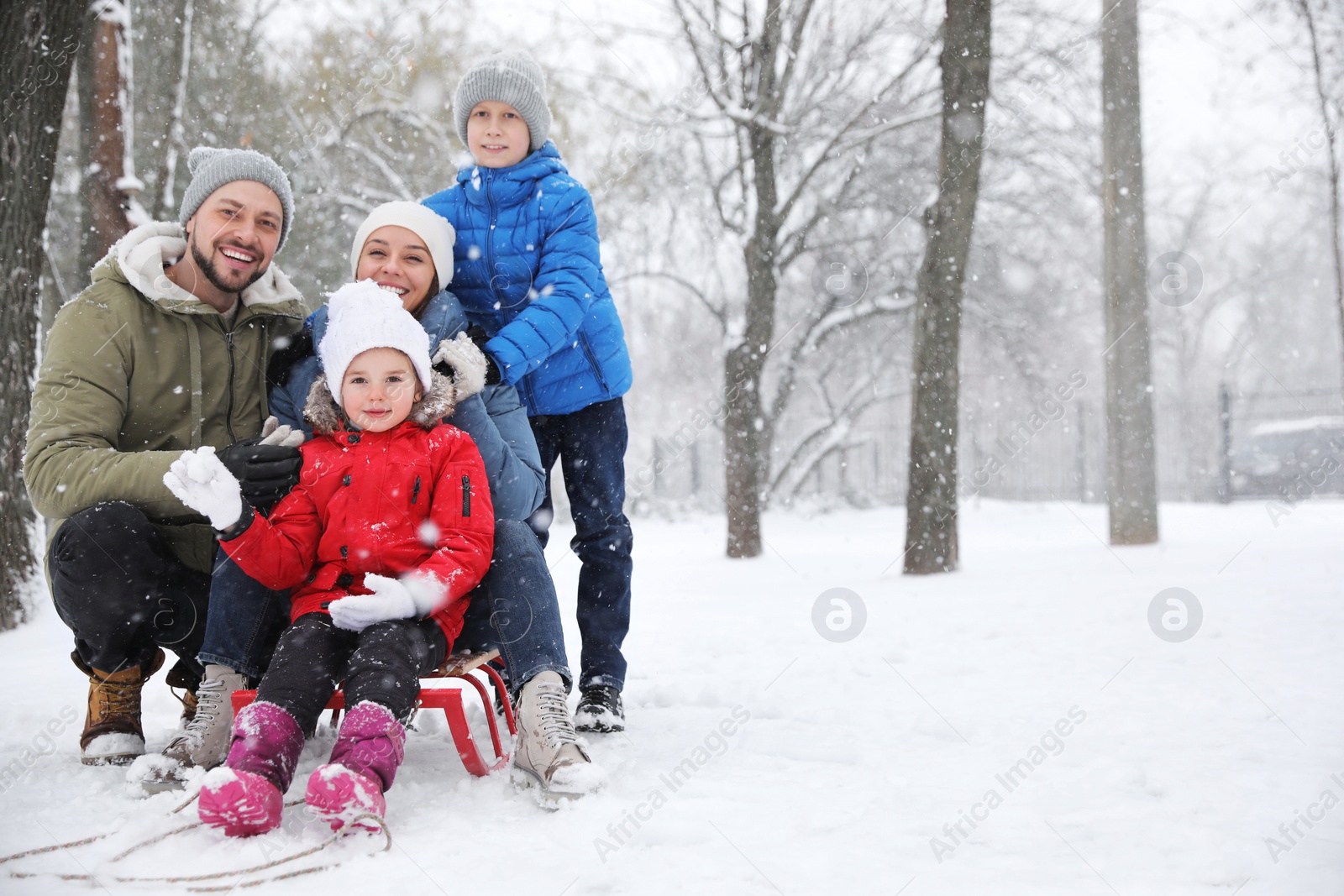 Photo of Portrait of happy family outside on winter day. Christmas vacation