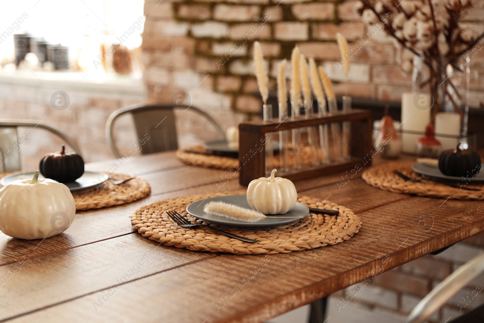 Photo of Wooden table decorated for Halloween in kitchen