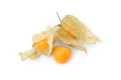 Photo of Ripe physalis fruits with calyxes isolated on white, top view