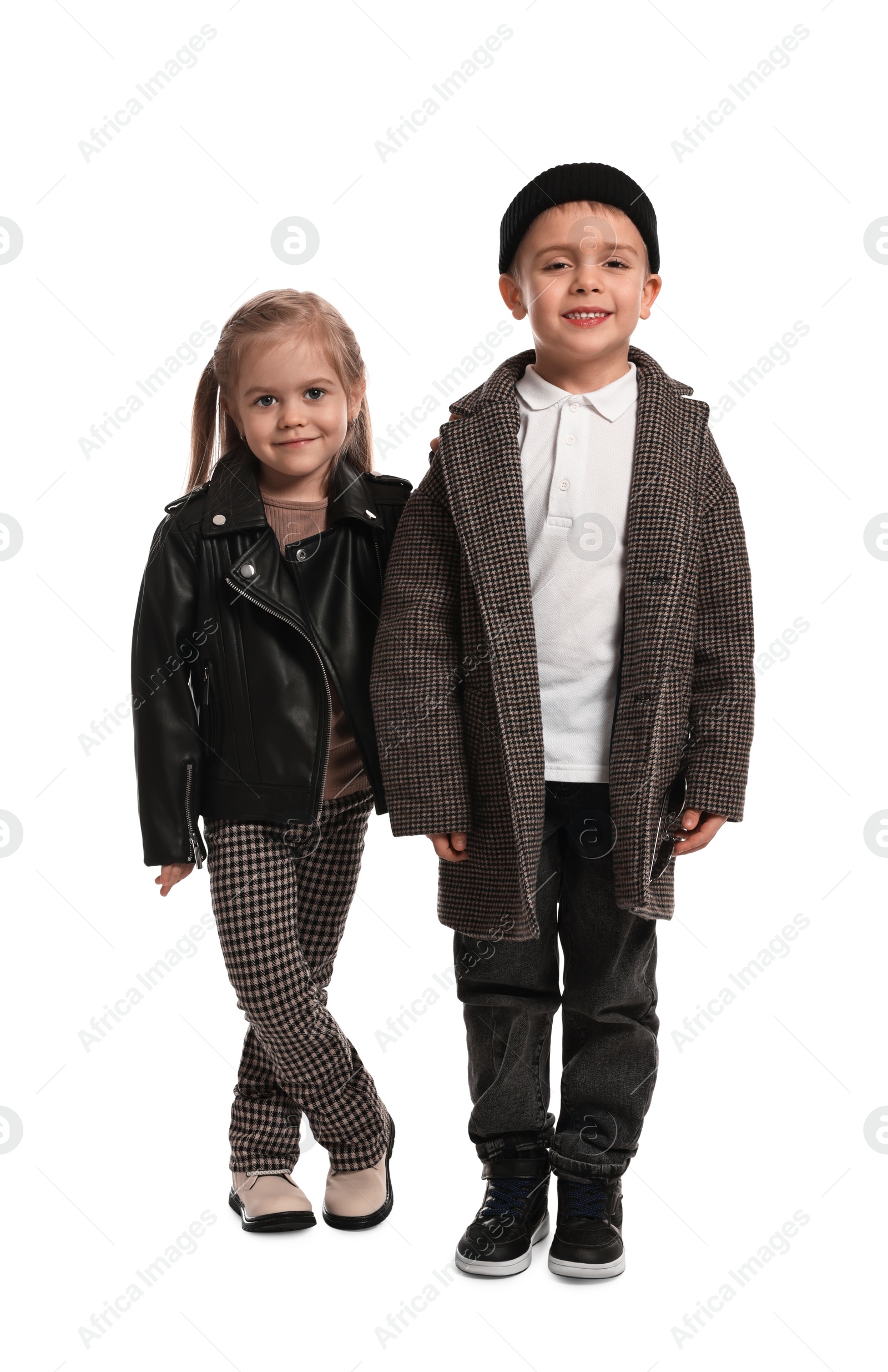 Photo of Fashion concept. Stylish children posing on white background