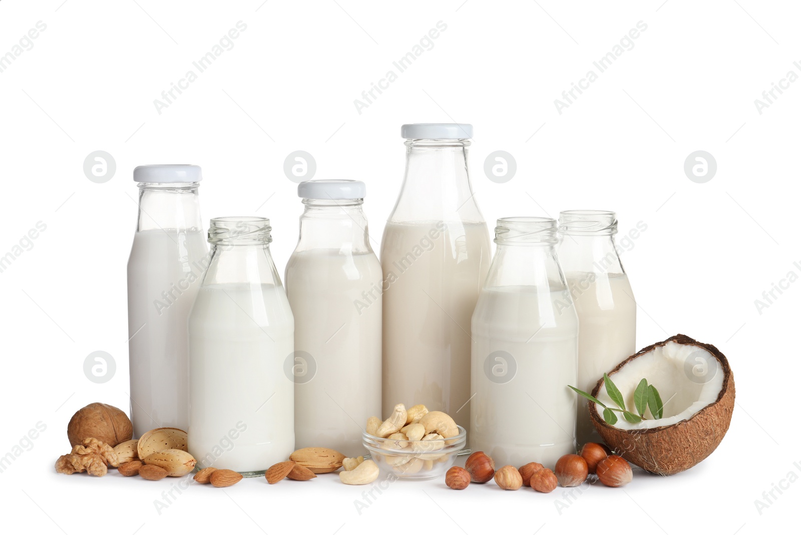 Photo of Vegan milk and different nuts on white background