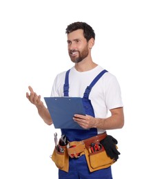 Professional plumber with clipboard and tool belt on white background