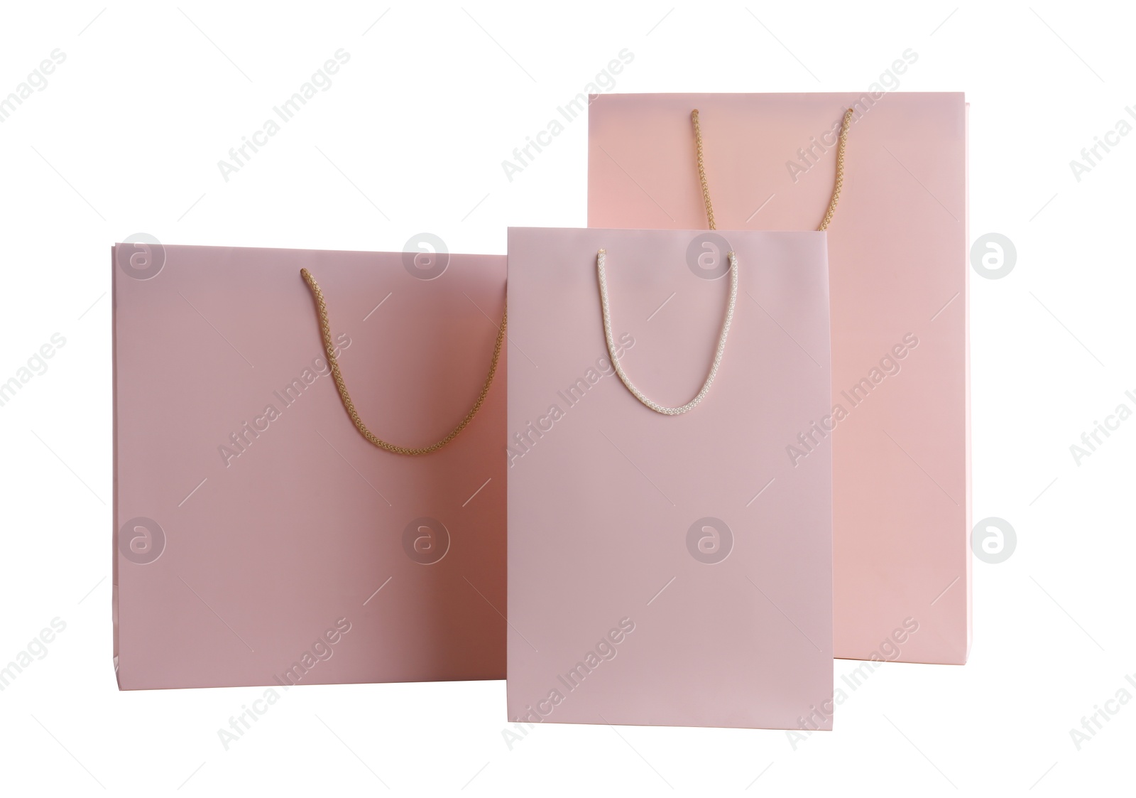 Photo of Pink paper shopping bags isolated on white