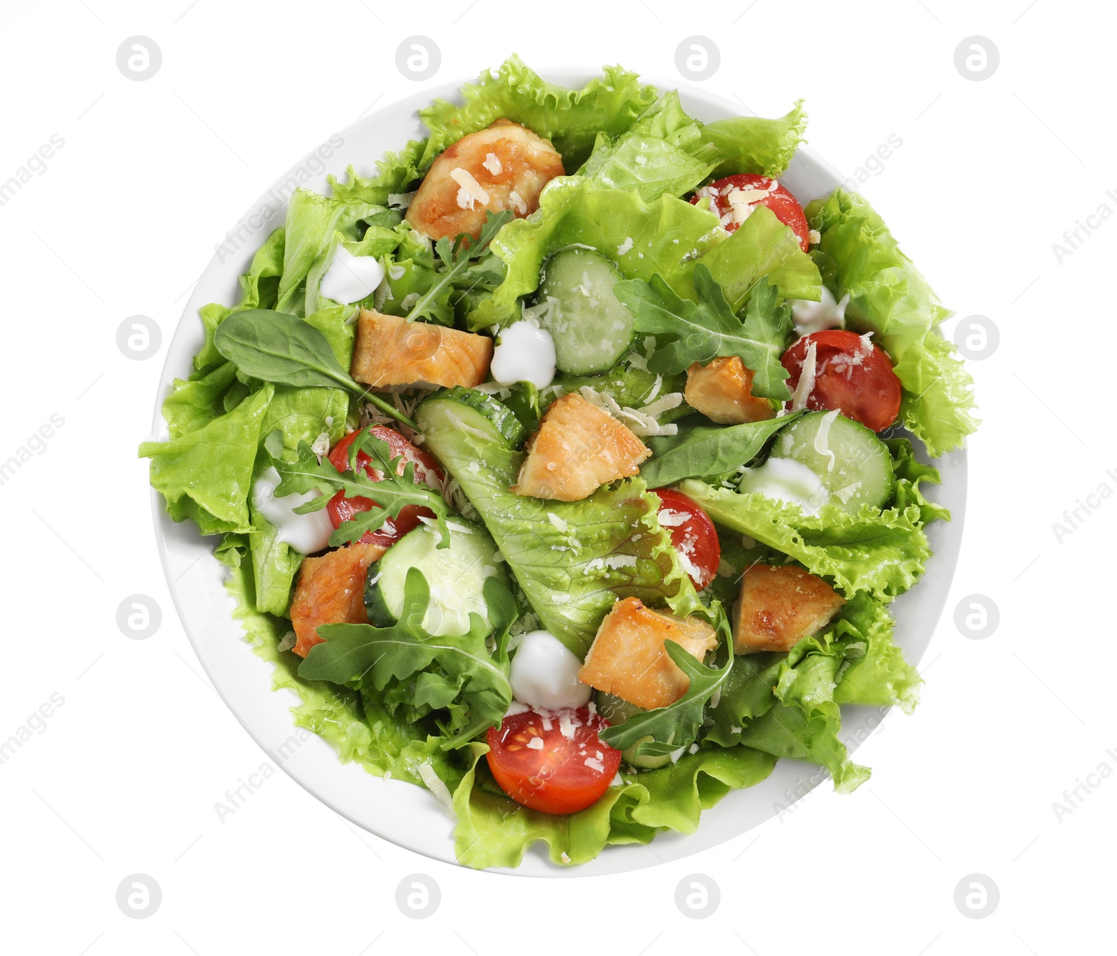 Photo of Delicious salad with chicken and vegetables in bowl isolated on white, top view