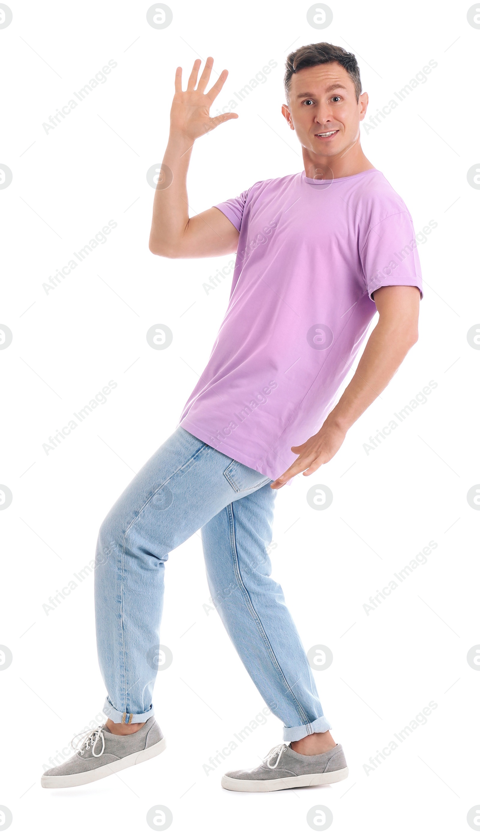Photo of Happy attractive man dancing on white background