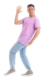 Happy attractive man dancing on white background