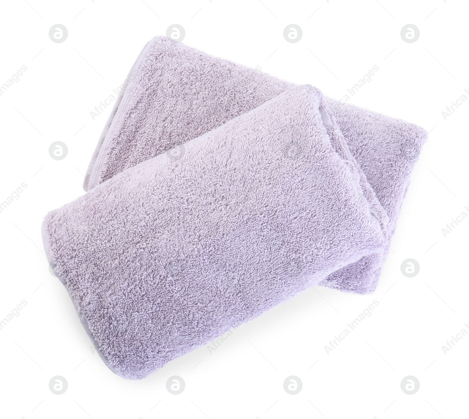 Photo of Folded violet terry towels isolated on white, top view