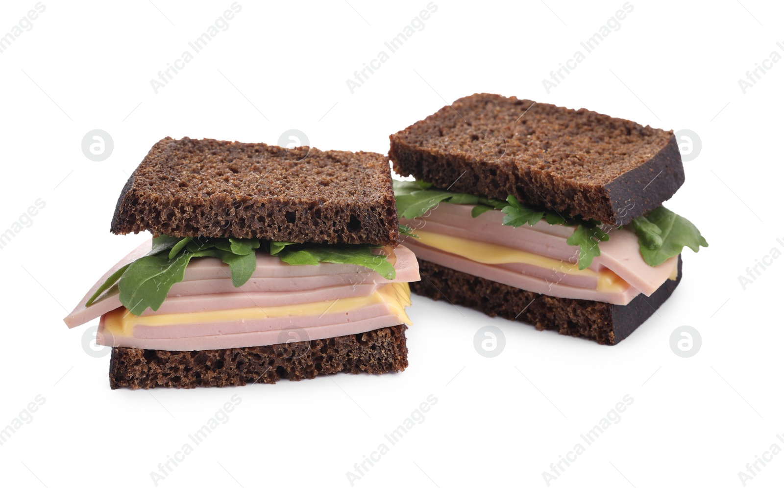 Photo of Delicious sandwiches with boiled sausage, cheese and arugula isolated on white