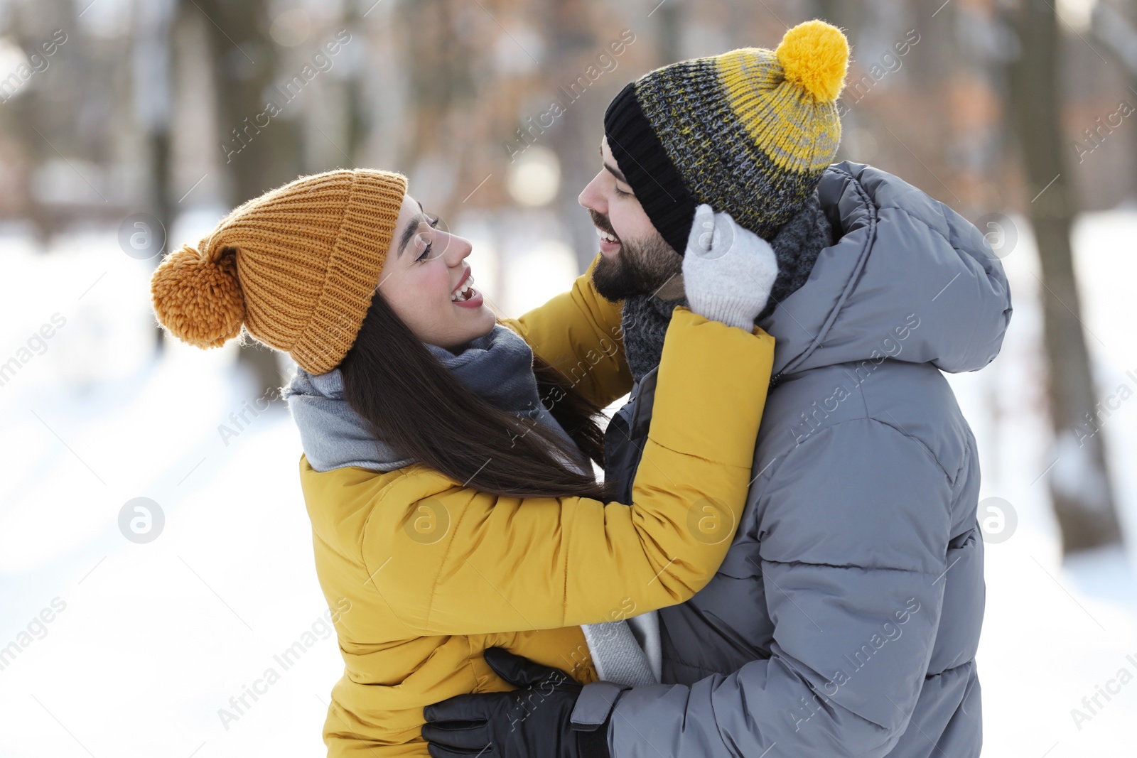 Photo of Happy young couple having fun outdoors on winter day