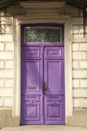 Closed vintage wooden door in old building