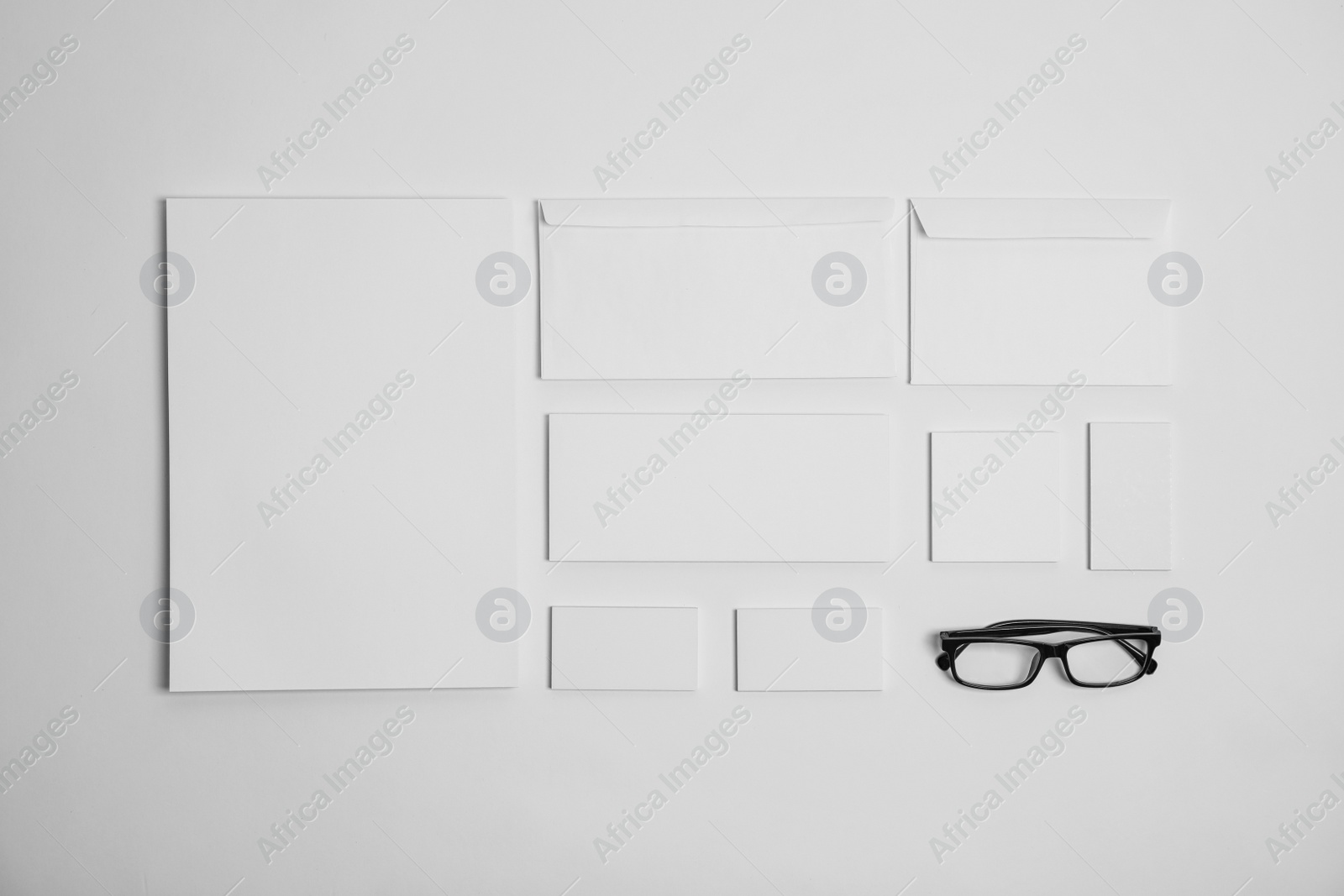 Photo of Flat lay composition with stationery on light background. Mock up for design