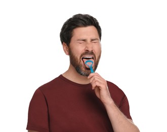 Photo of Handsome man brushing his tongue with cleaner on white background