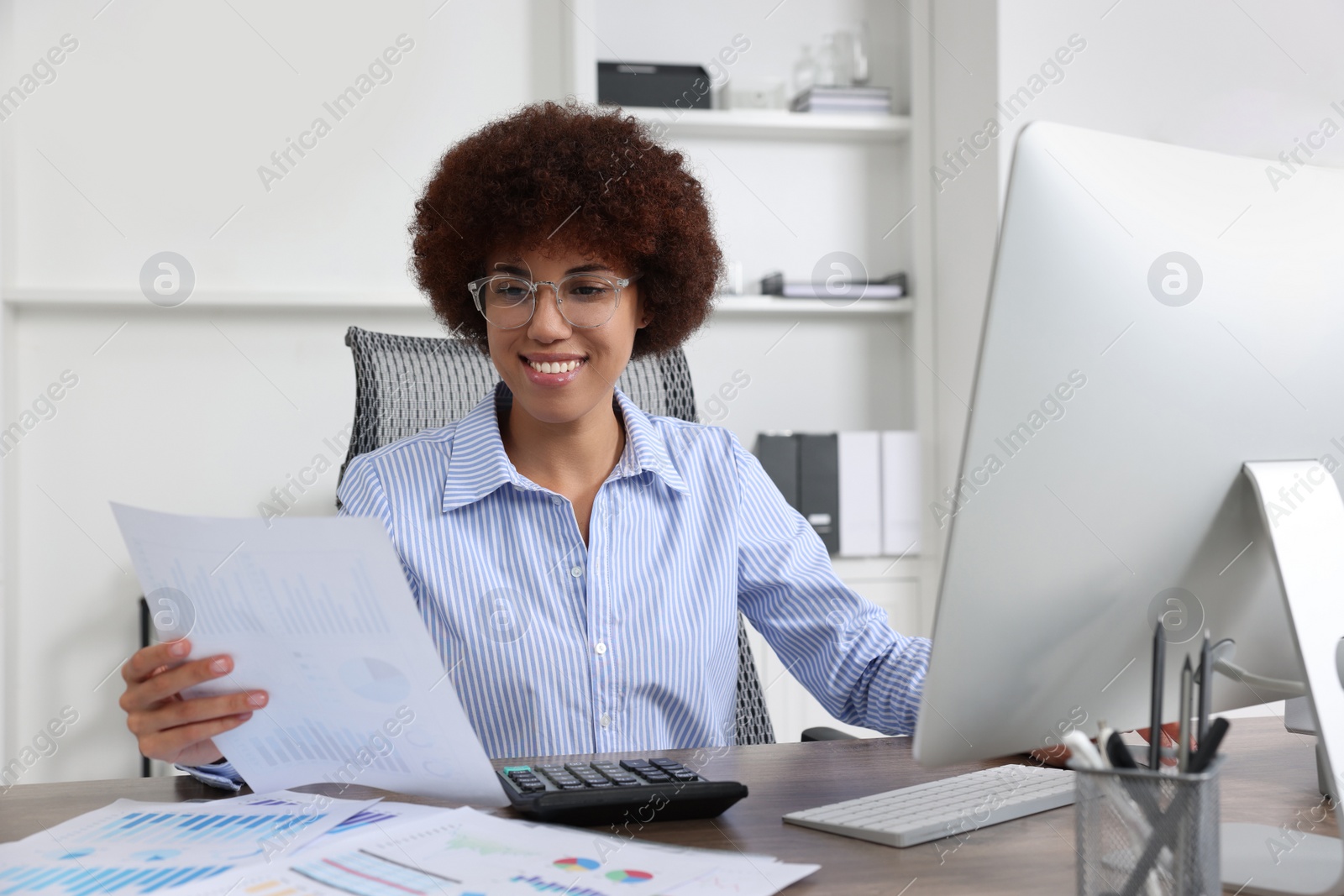 Photo of Professional accountant working on computer in office