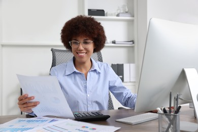 Professional accountant working on computer in office