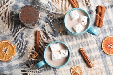 Flat lay composition with hot cocoa drink on fabric