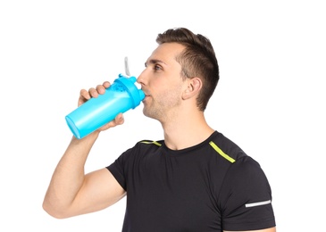 Photo of Portrait of man drinking protein shake on white background