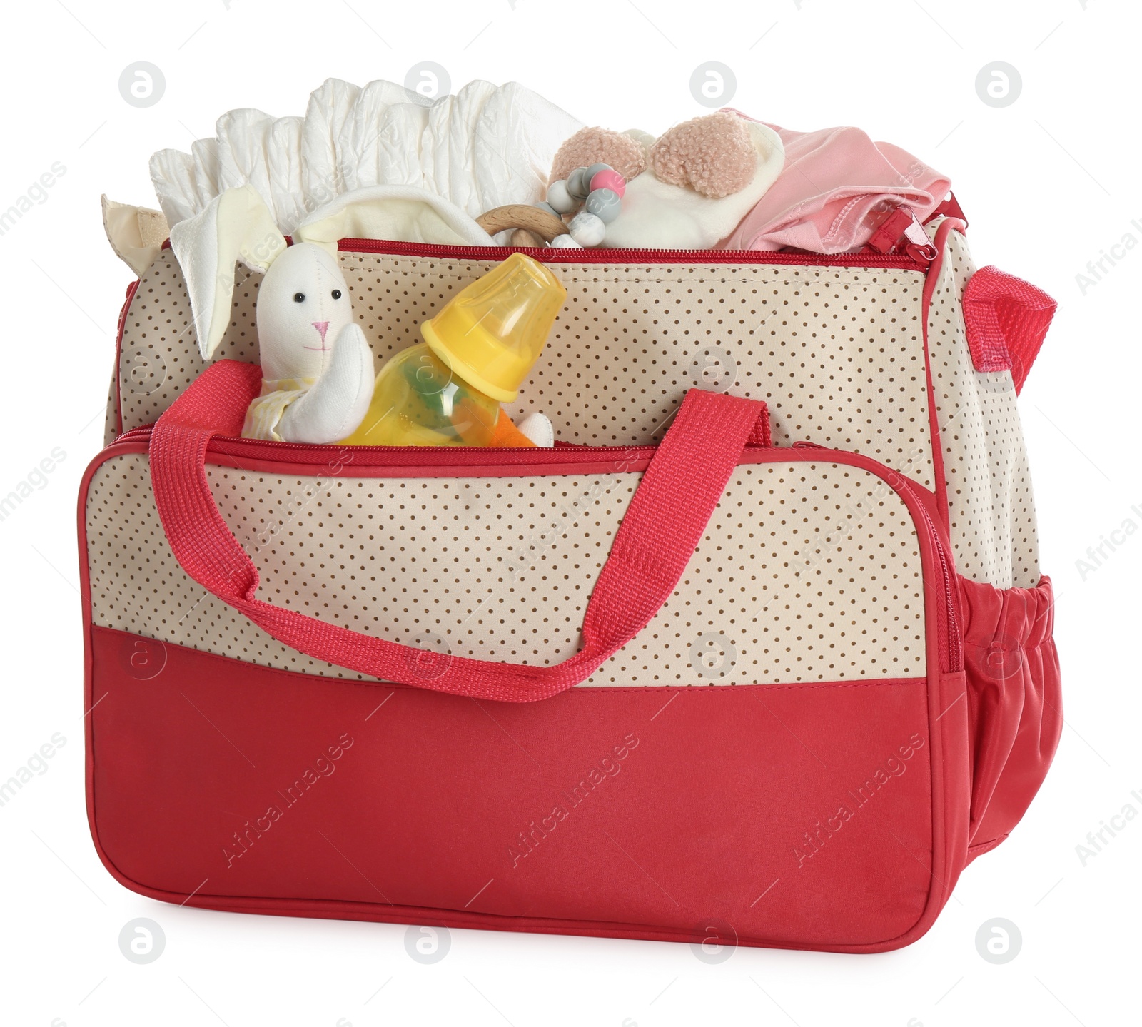 Photo of Mother's bag with baby's stuff isolated on white