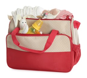 Photo of Mother's bag with baby's stuff isolated on white