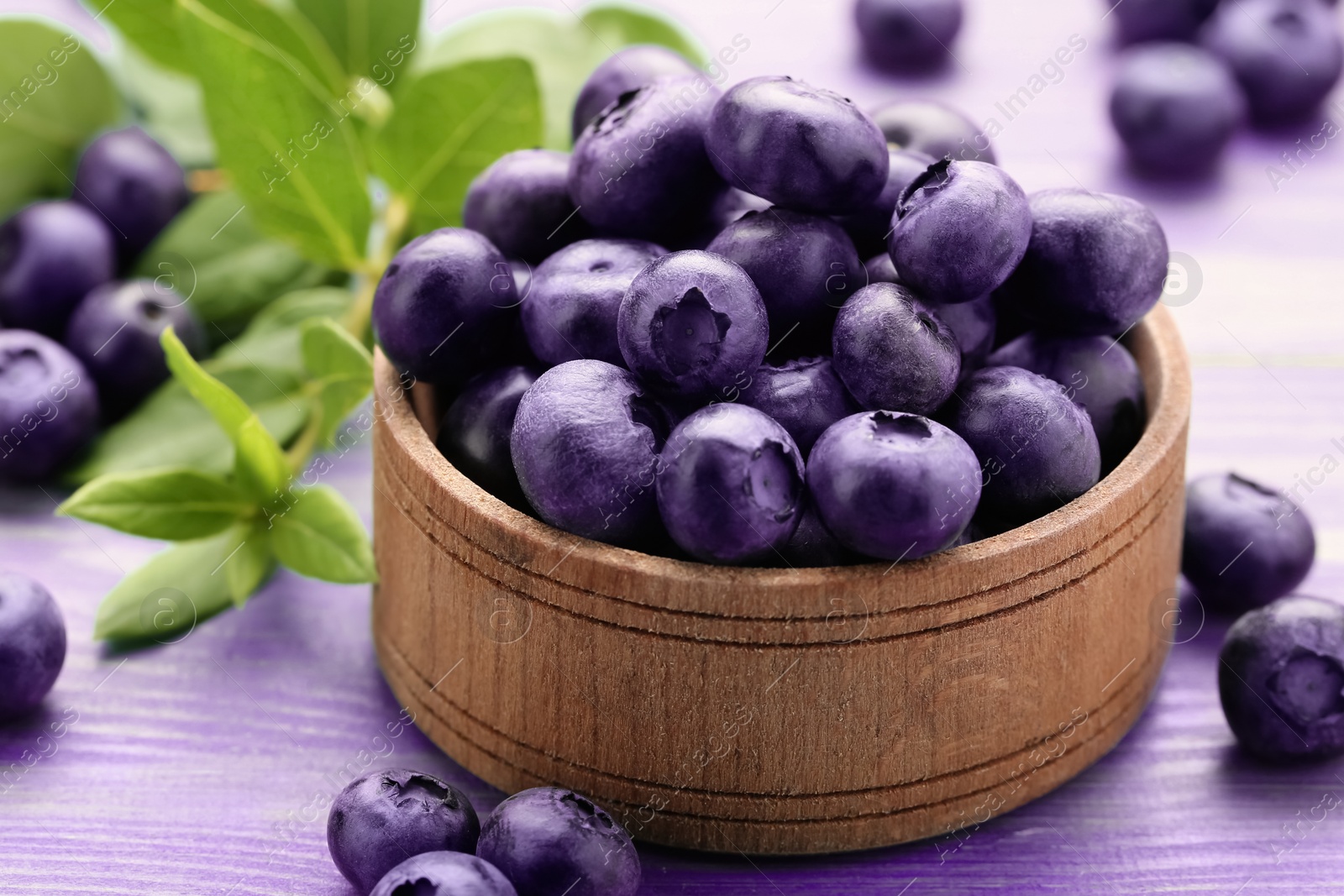 Image of Tasty fresh blueberries on wooden table, closeup