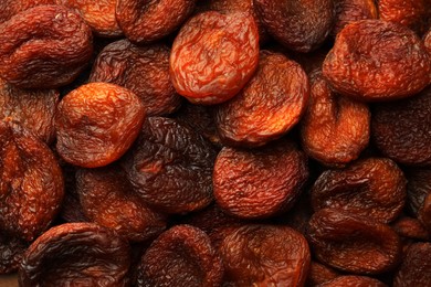 Photo of Tasty dried apricots as background, top view. Healthy snack