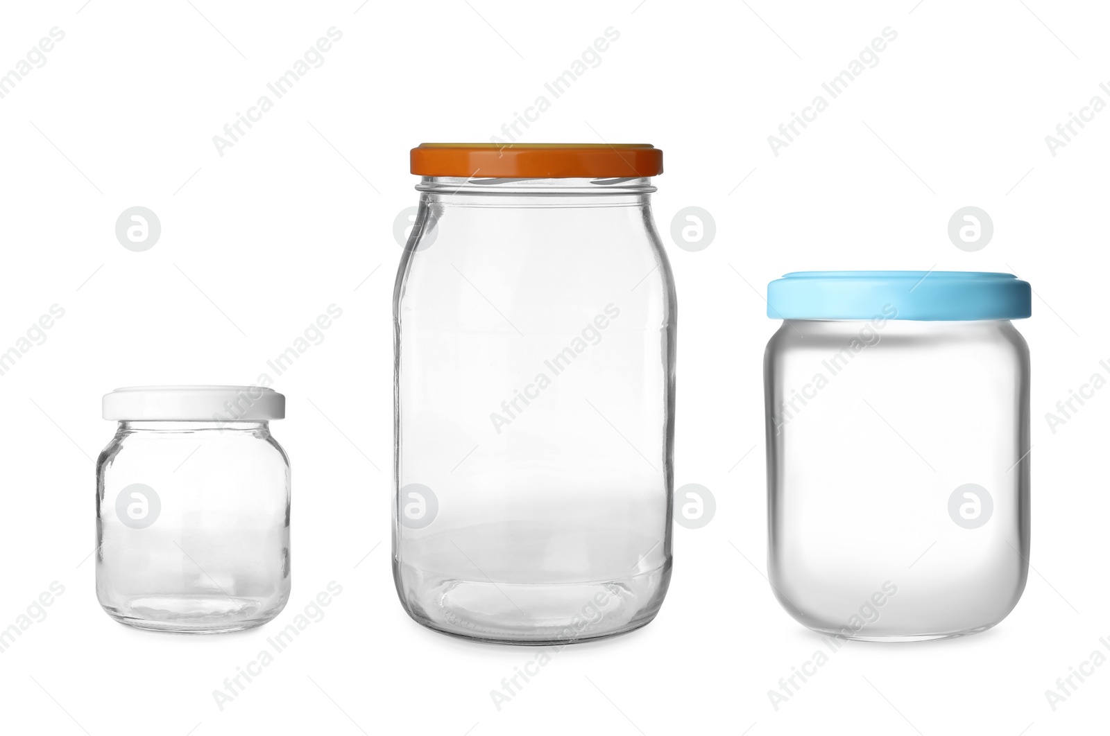 Image of Set with closed empty glass jars on white background