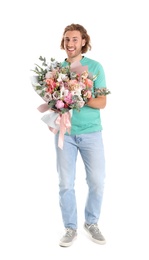 Photo of Young handsome man with beautiful flower bouquet on white background