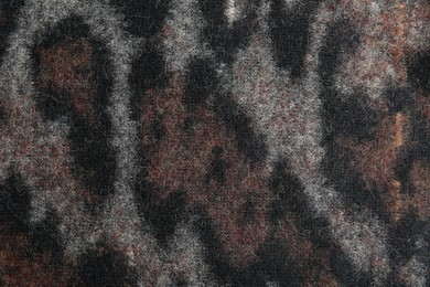 Photo of Texture of beautiful fabric with animal pattern as background, closeup