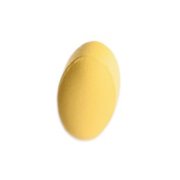 Photo of One pale orange pill isolated on white