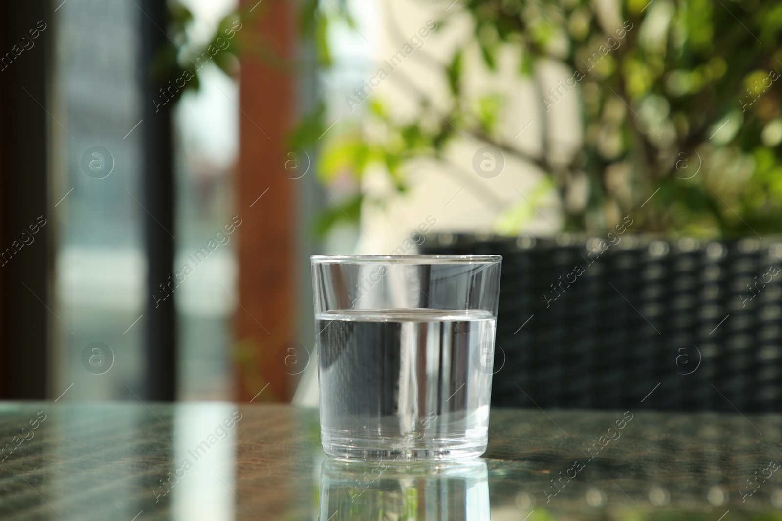 Photo of Glass of fresh pure water on table