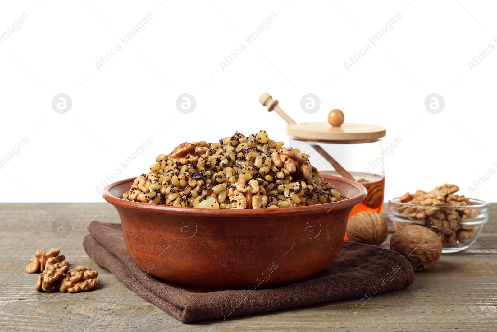 Photo of Traditional Christmas slavic dish kutia on wooden table against white background