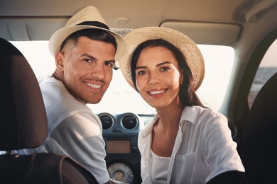 Photo of Happy couple in car on road trip