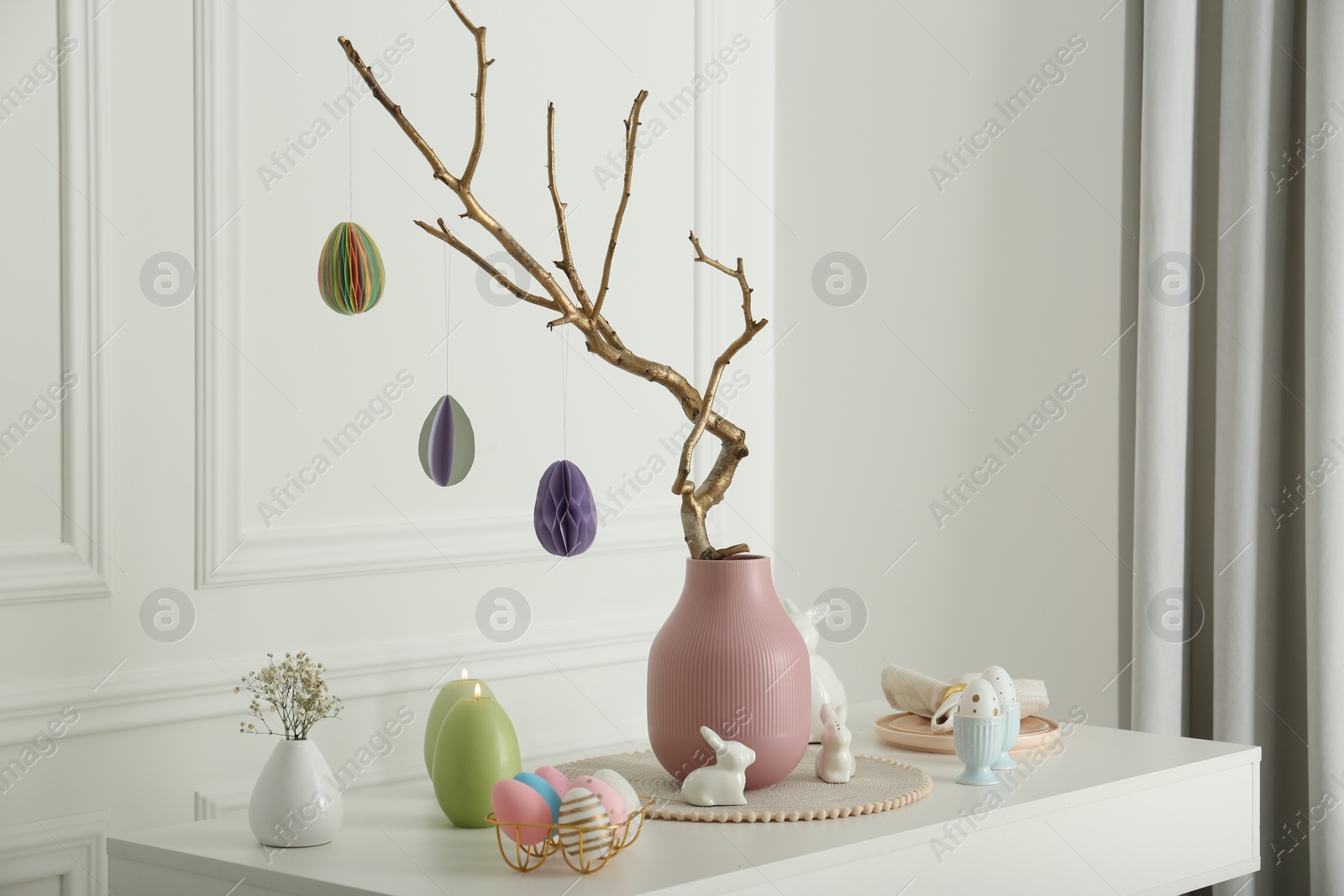 Photo of Beautiful festive composition with Easter decor on white table indoors