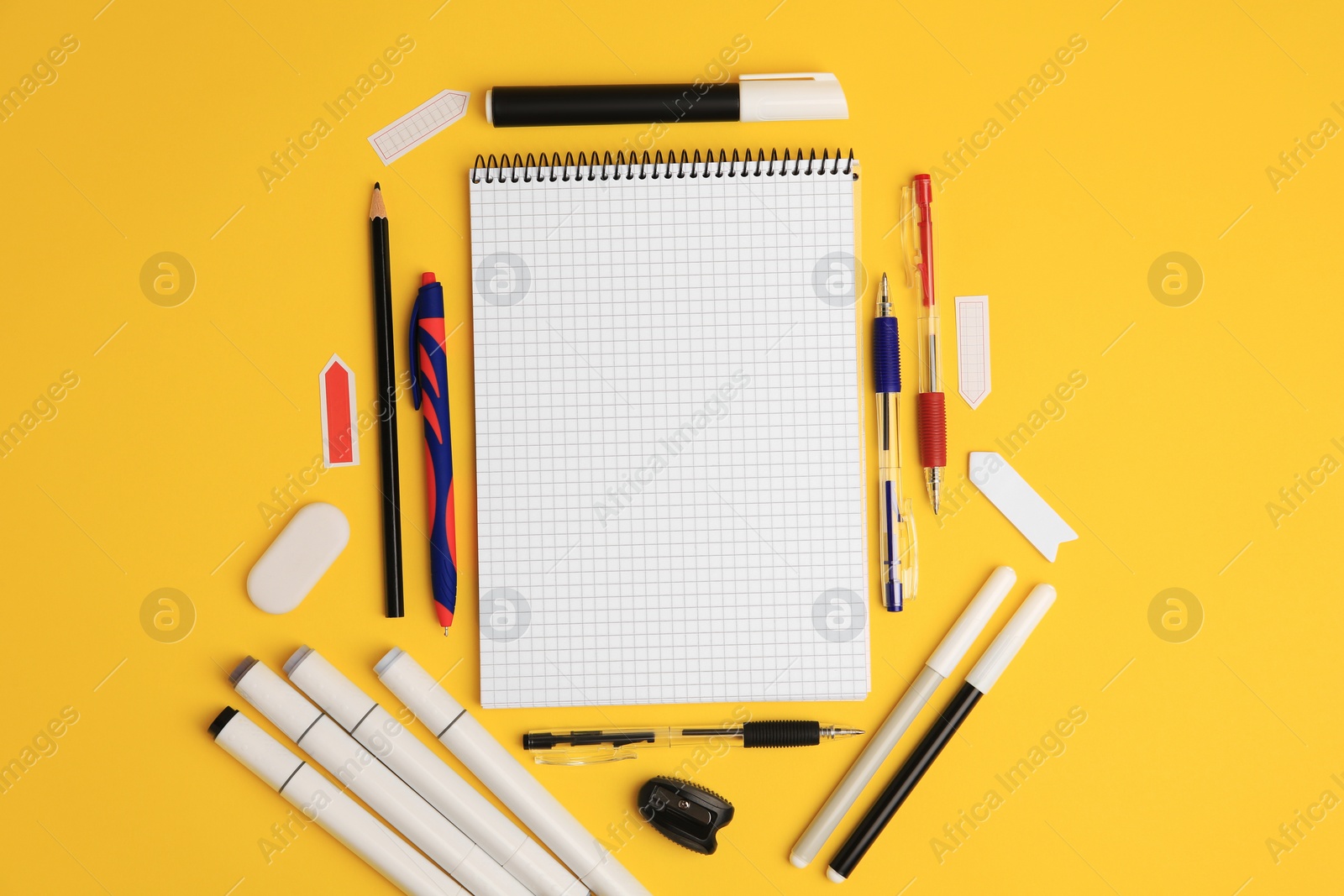 Photo of Different school stationery on yellow background, flat lay with space for text. Back to school