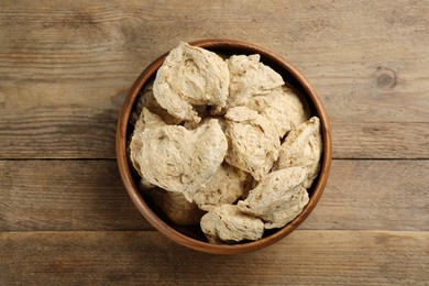 Dried soy meat on wooden table, top view