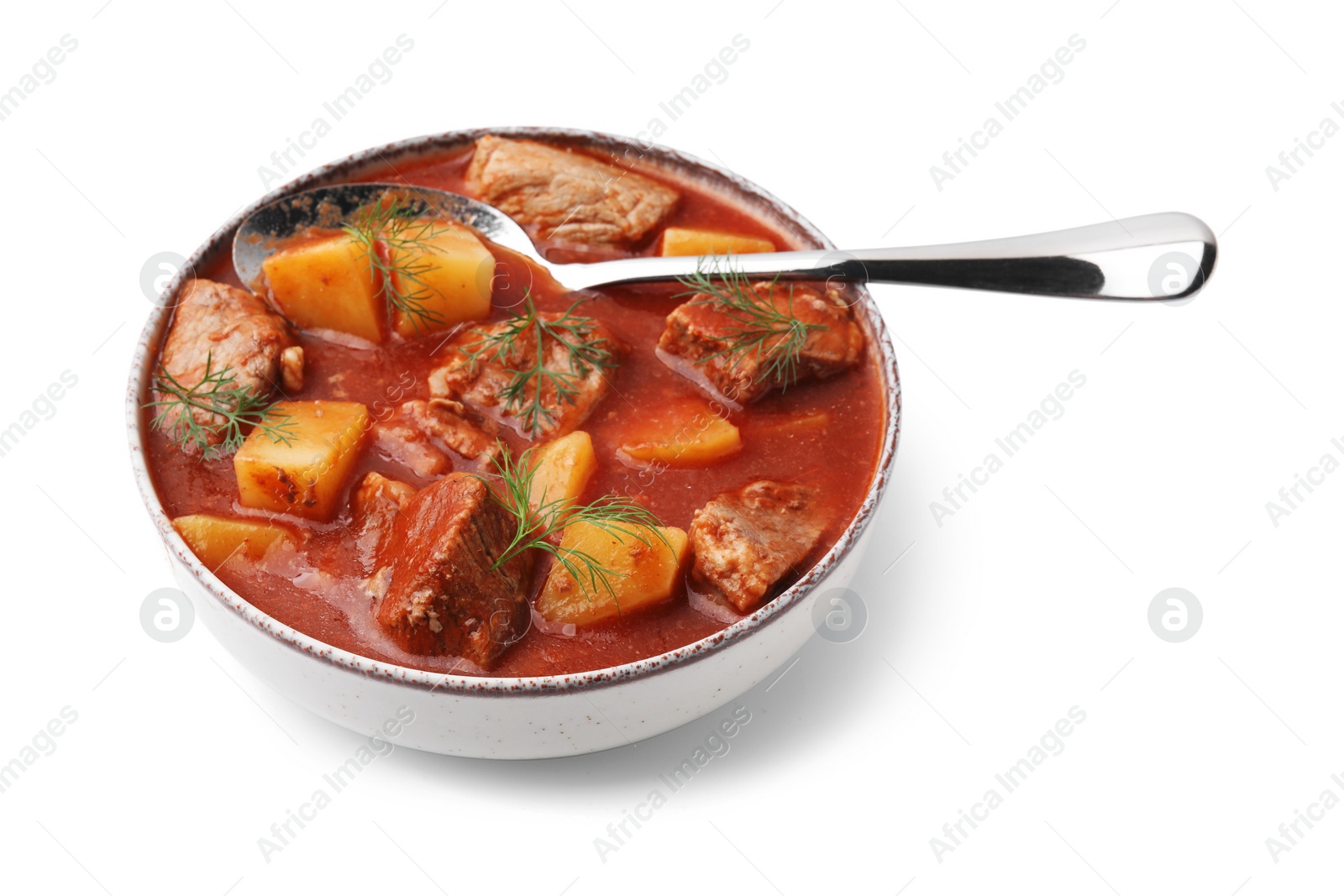 Photo of Delicious goulash in bowl isolated on white