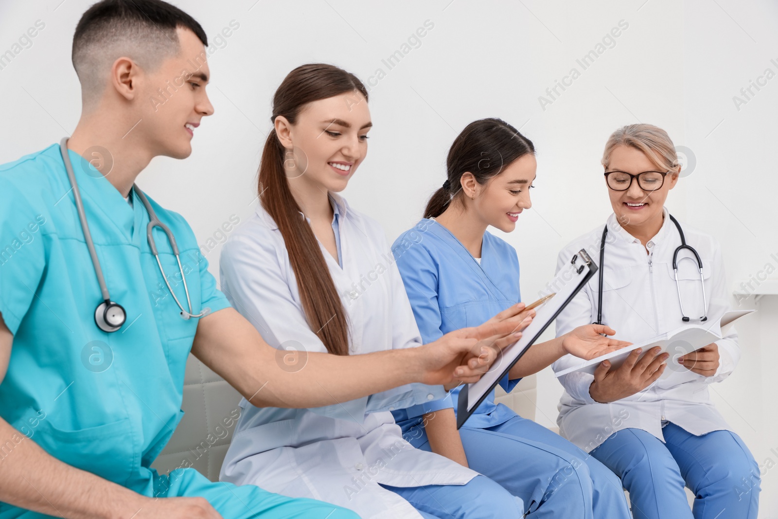 Photo of Team of professional doctors working together in clinic